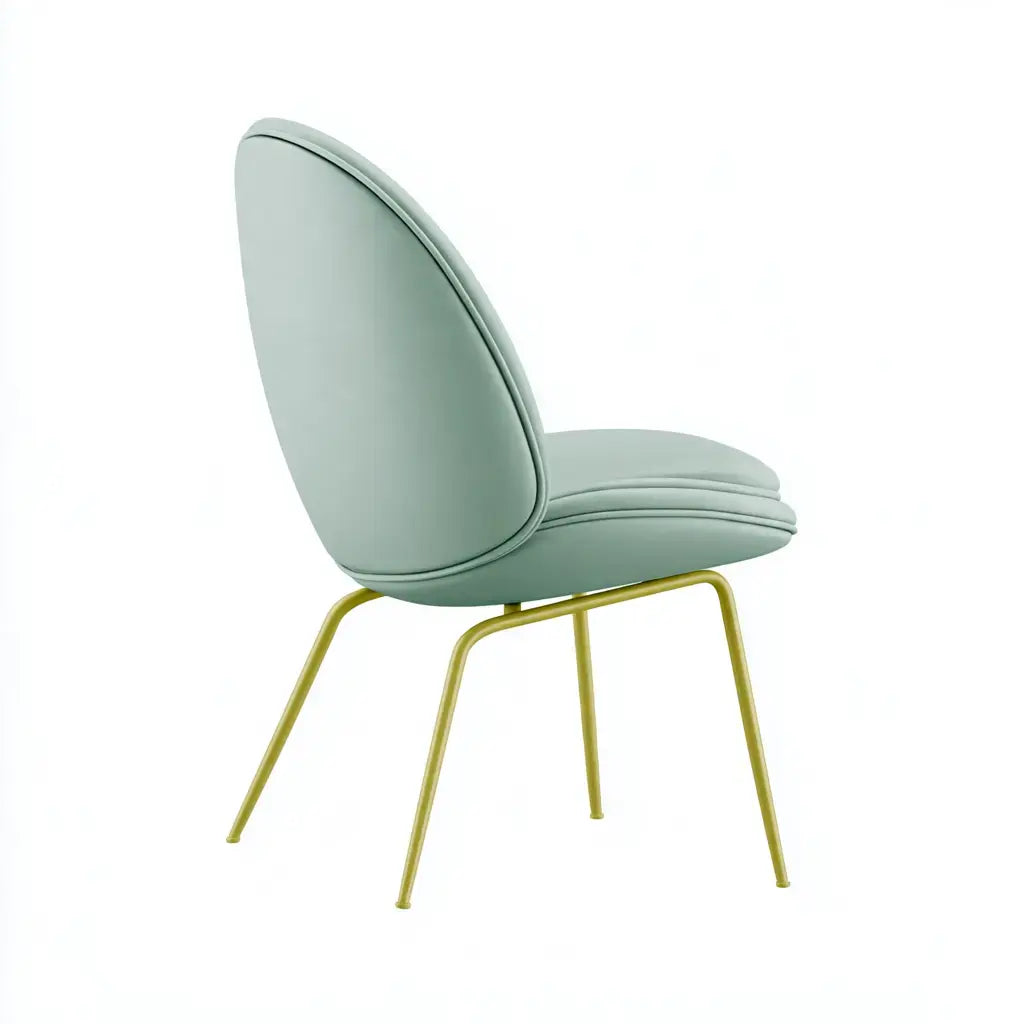 Craftandcrux green chair with curved backrest and slender legs, showcasing modern design and vibrant upholstery.