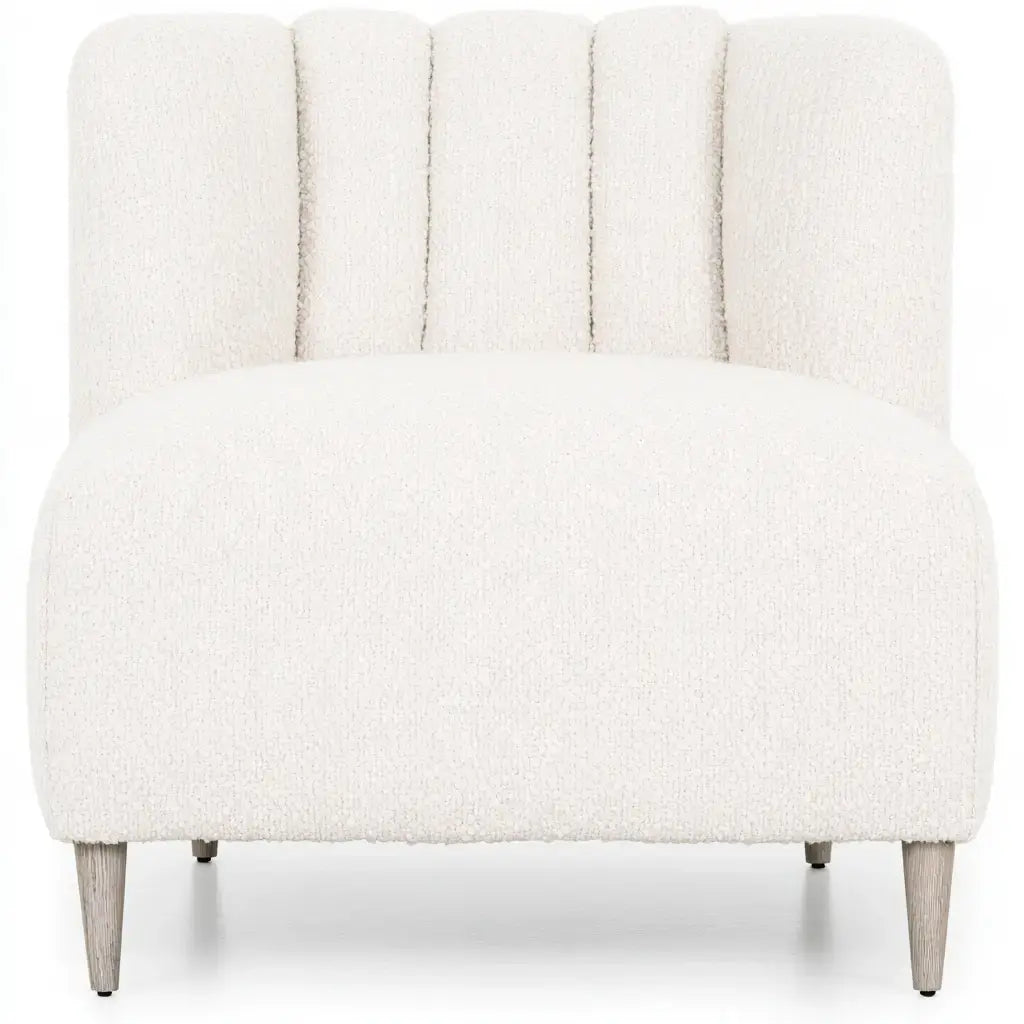 White armless lounge chair with a segmented backrest by CraftandCrux, showcasing a modern, minimalist design.
