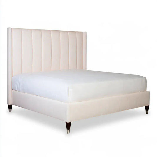 Beige bed with vertical stripe headboard from CraftandCrux's Collections, showcasing a stylish and comfortable bedroom setup.
